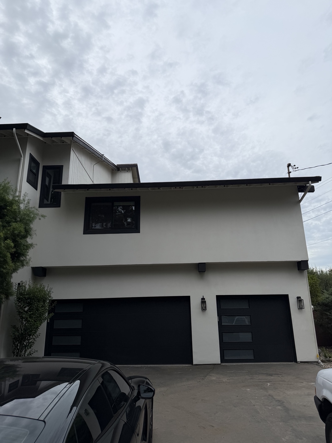 Daytime view of a home with a discreet permanent lighting installation